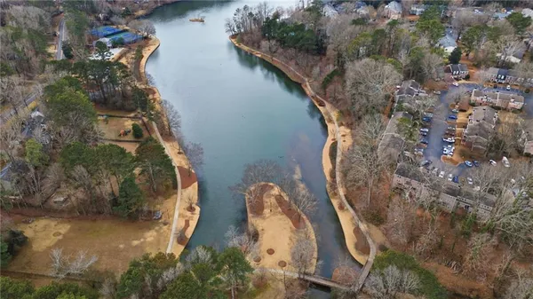 an aerial view of a house with a yard
