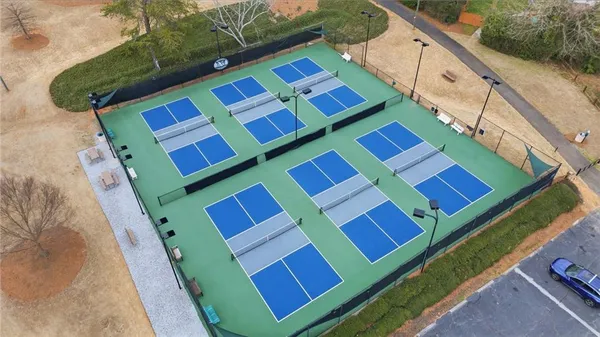 a view of a tennis ground with windows
