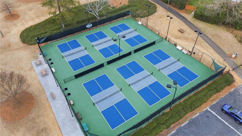 256 Quail Run, Unit 256 Roswell, GA 30076 - Photo 30 of 33 a view of a tennis ground with windows