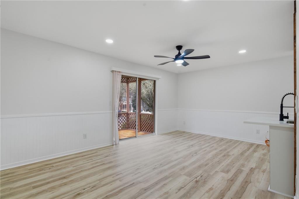256 Quail Run, Unit 256 Roswell, GA 30076 - Photo 3 of 33 wooden floor in an empty room with a window