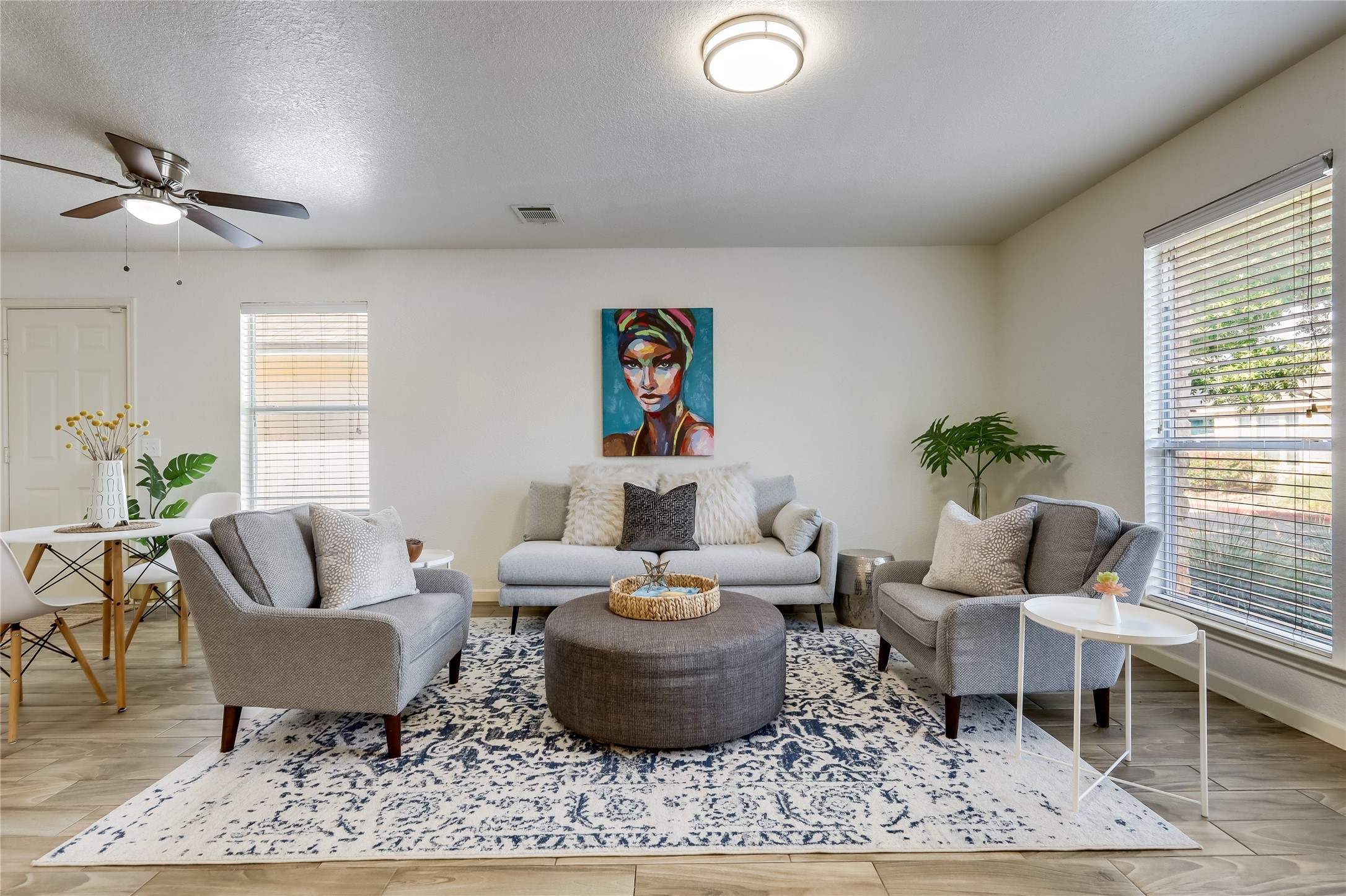 4510 Secure Lane Austin, TX 78725 - Photo 1 of 24 a living room with furniture and a rug