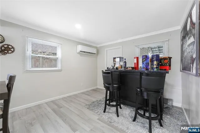 a view of a dining room with furniture and a window