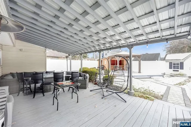 a view of a livingroom with furniture and a window