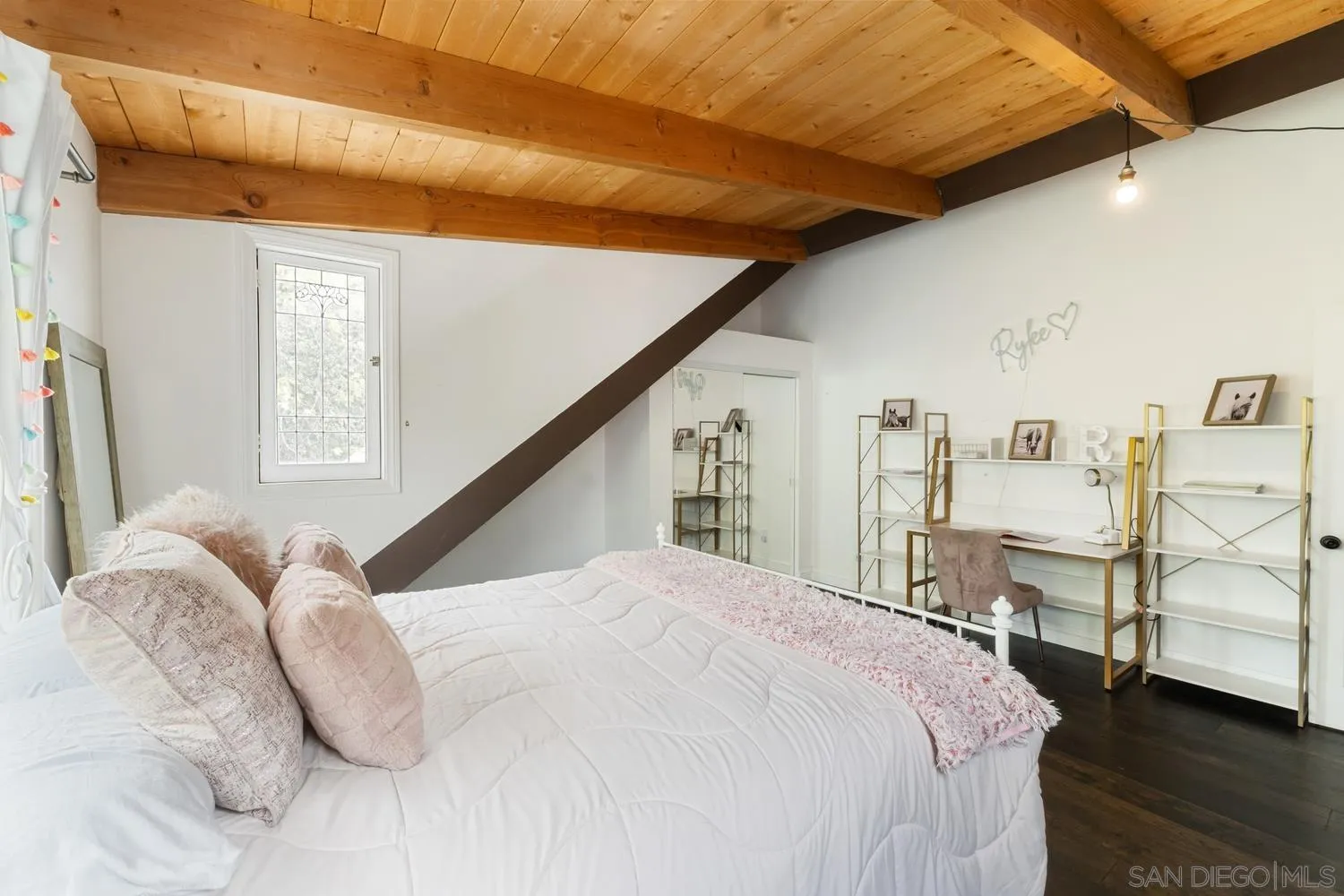 3517 Deer Lake Park Road Julian, CA 92036 - Photo 27 of 75 a large bed sitting in a bedroom next to a window with pc on the wall