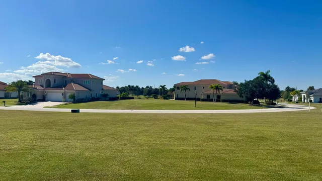a view of a swimming pool and a yard