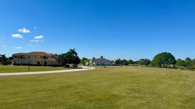 a view of a large swimming pool with an ocean view