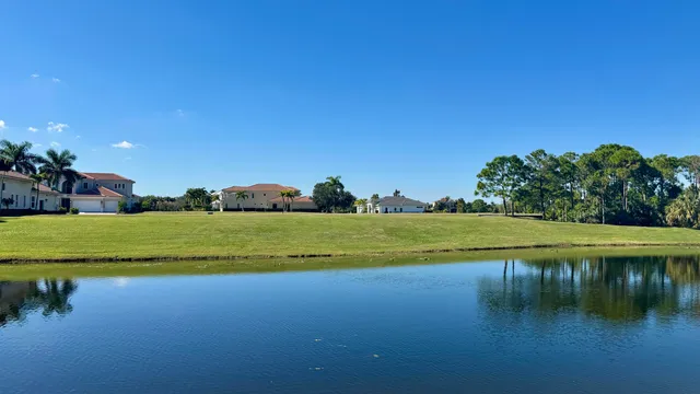 a view of a lake with houses in the background