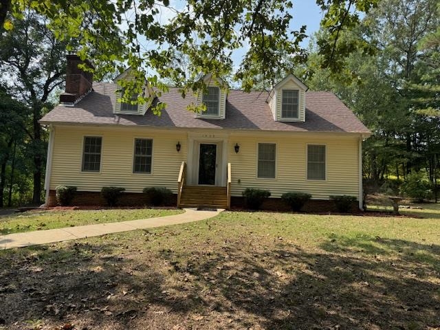1409 Roper Road Bolivar, TN 38008 - Photo 1 of 33 New england style home with a front lawn