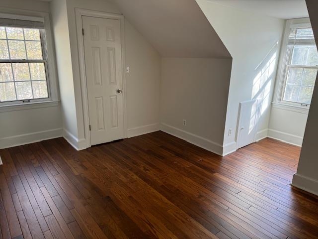 1409 Roper Road Bolivar, TN 38008 - Photo 14 of 33 Additional living space with dark hardwood / wood-style flooring and vaulted ceiling