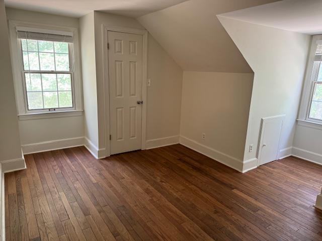 1409 Roper Road Bolivar, TN 38008 - Photo 17 of 33 Additional living space featuring dark hardwood / wood-style floors and vaulted ceiling