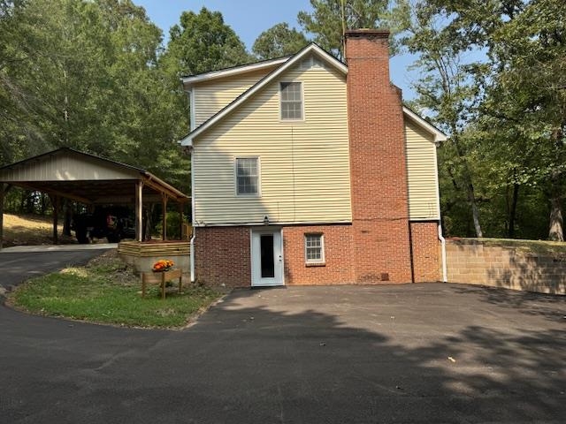 1409 Roper Road Bolivar, TN 38008 - Photo 2 of 33 View of property exterior featuring a carport