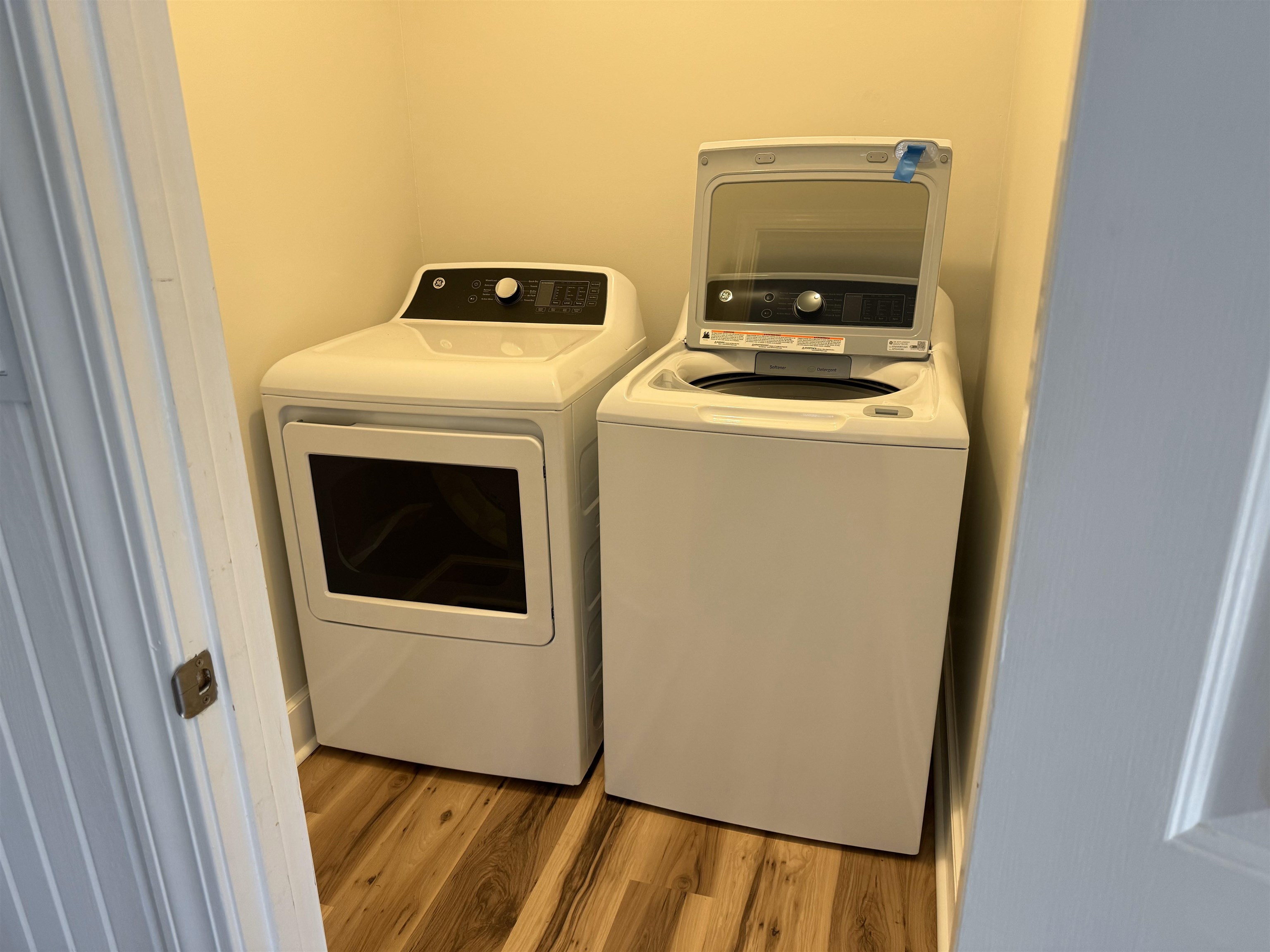 1409 Roper Road Bolivar, TN 38008 - Photo 23 of 33 Laundry area with light hardwood / wood-style flooring and washer and clothes dryer