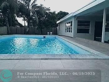 236 East 56th Street Hialeah, FL 33013 - Photo 3 of 7 a front view of a house with a yard