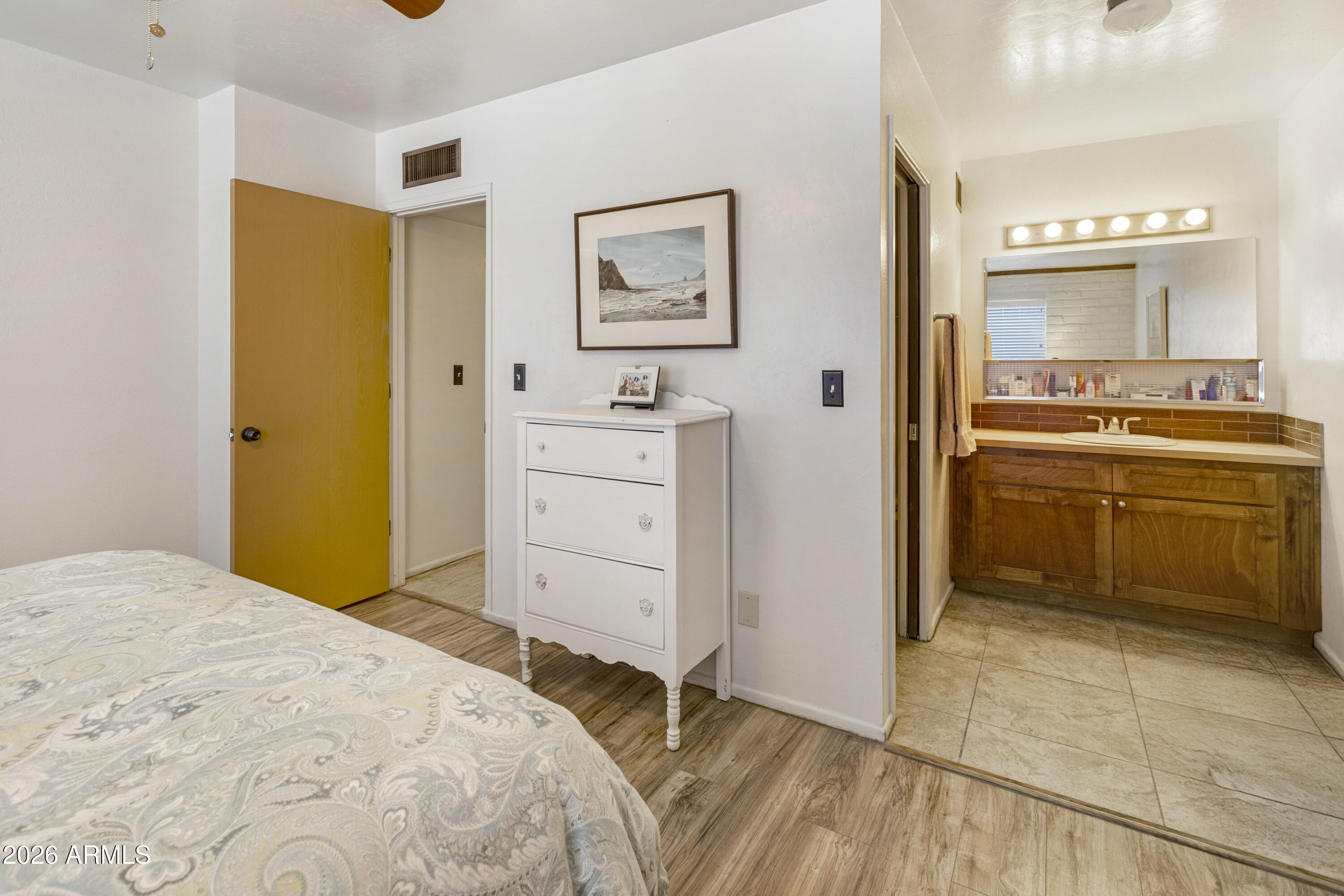 9111 North Oracle Road, Unit 110 Tucson, AZ 85704 - Photo 12 of 27 a bedroom with a bed and a cabinets