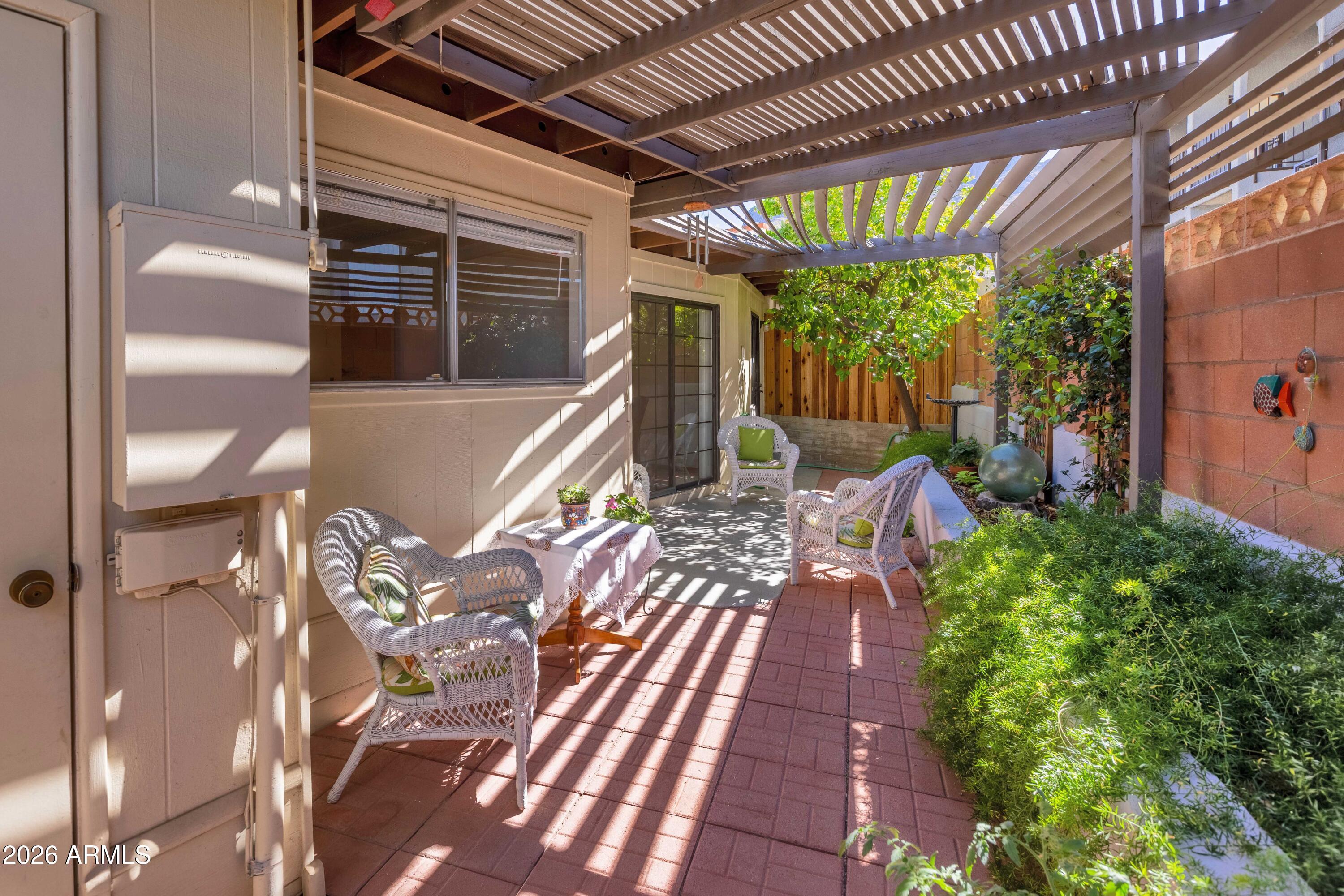 9111 North Oracle Road, Unit 110 Tucson, AZ 85704 - Photo 17 of 27 a view of a porch with furniture and a yard