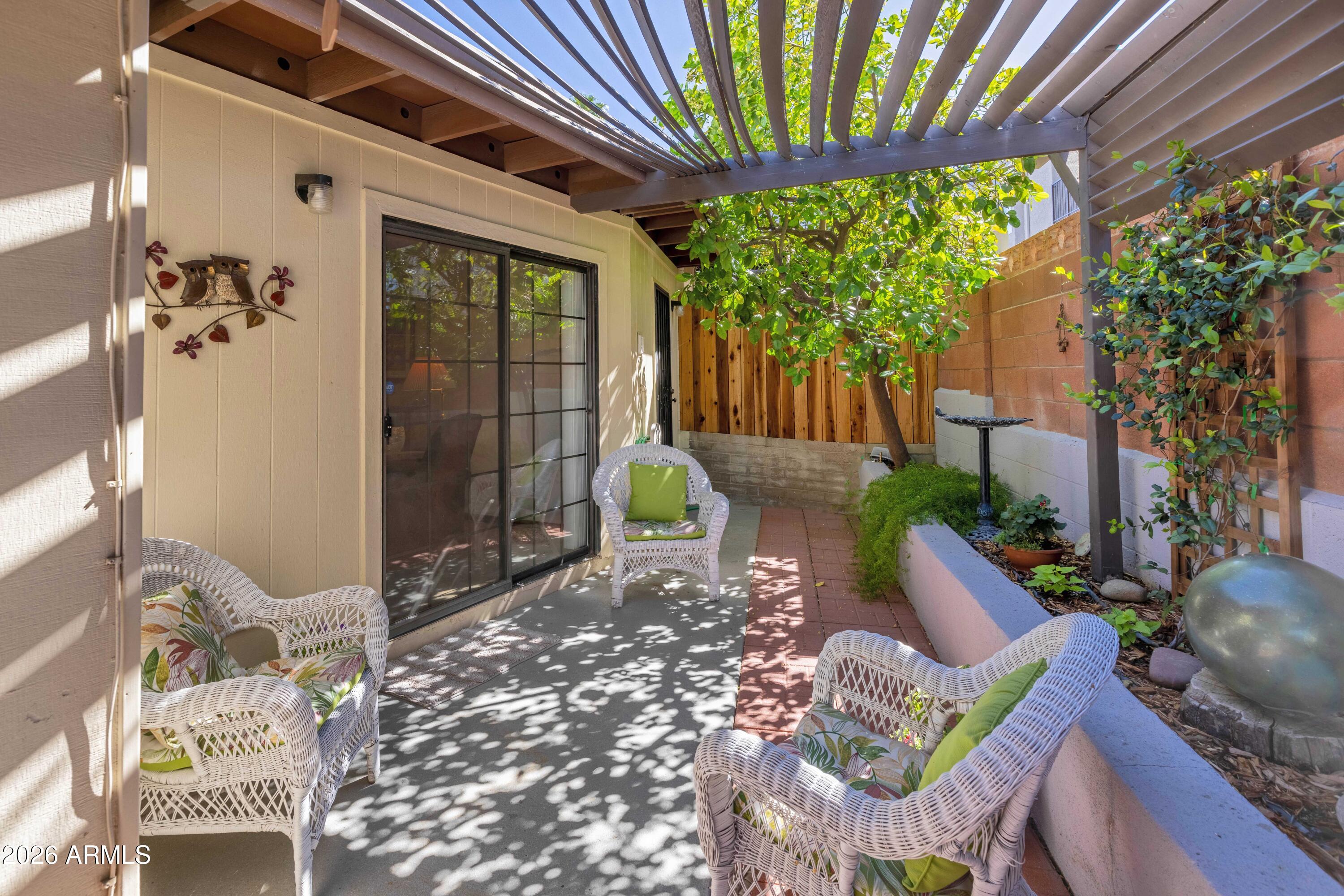 9111 North Oracle Road, Unit 110 Tucson, AZ 85704 - Photo 18 of 27 a front view of a house with outdoor seating