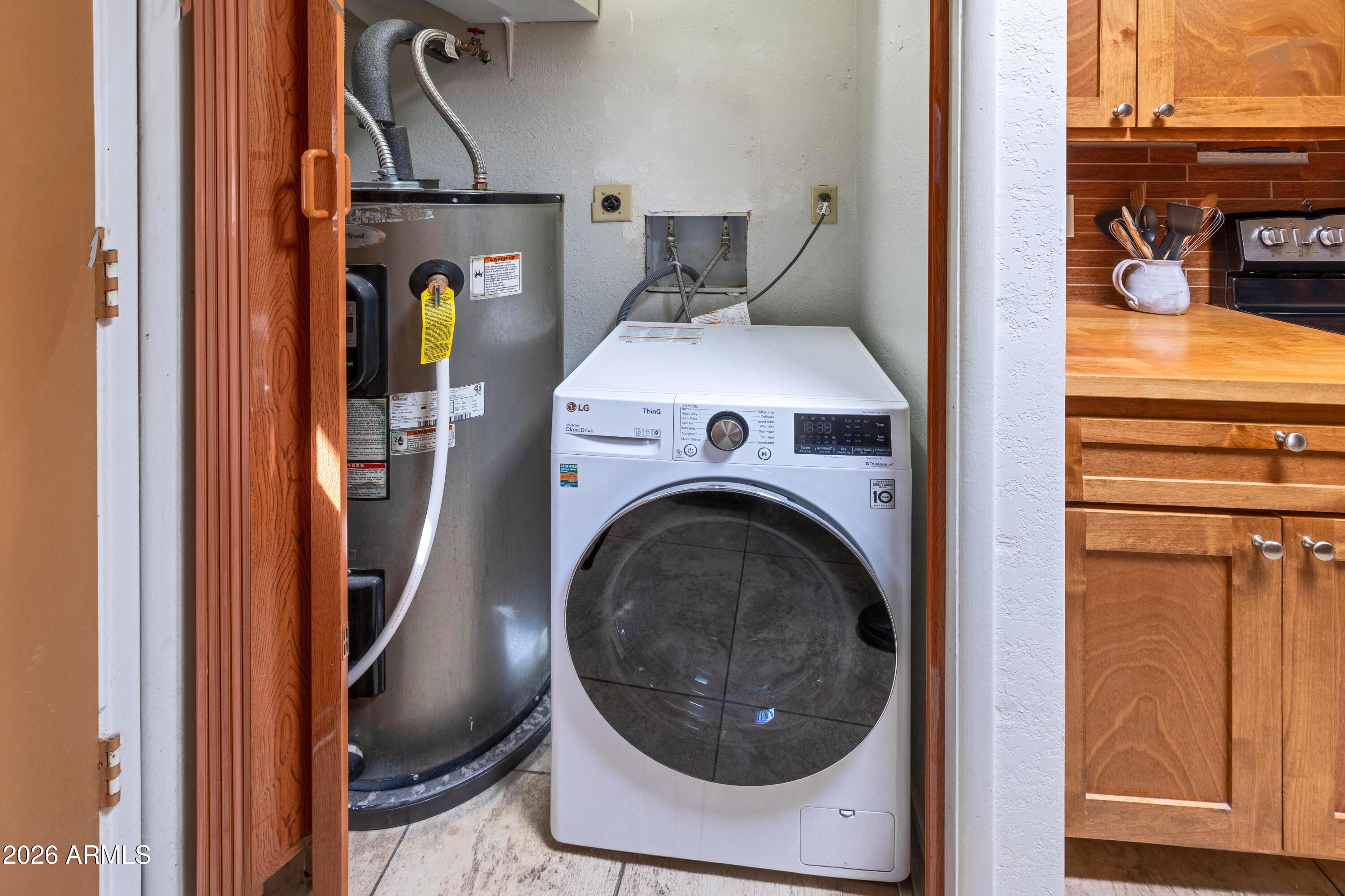 9111 North Oracle Road, Unit 110 Tucson, AZ 85704 - Photo 25 of 27 a utility room with dryer and washer