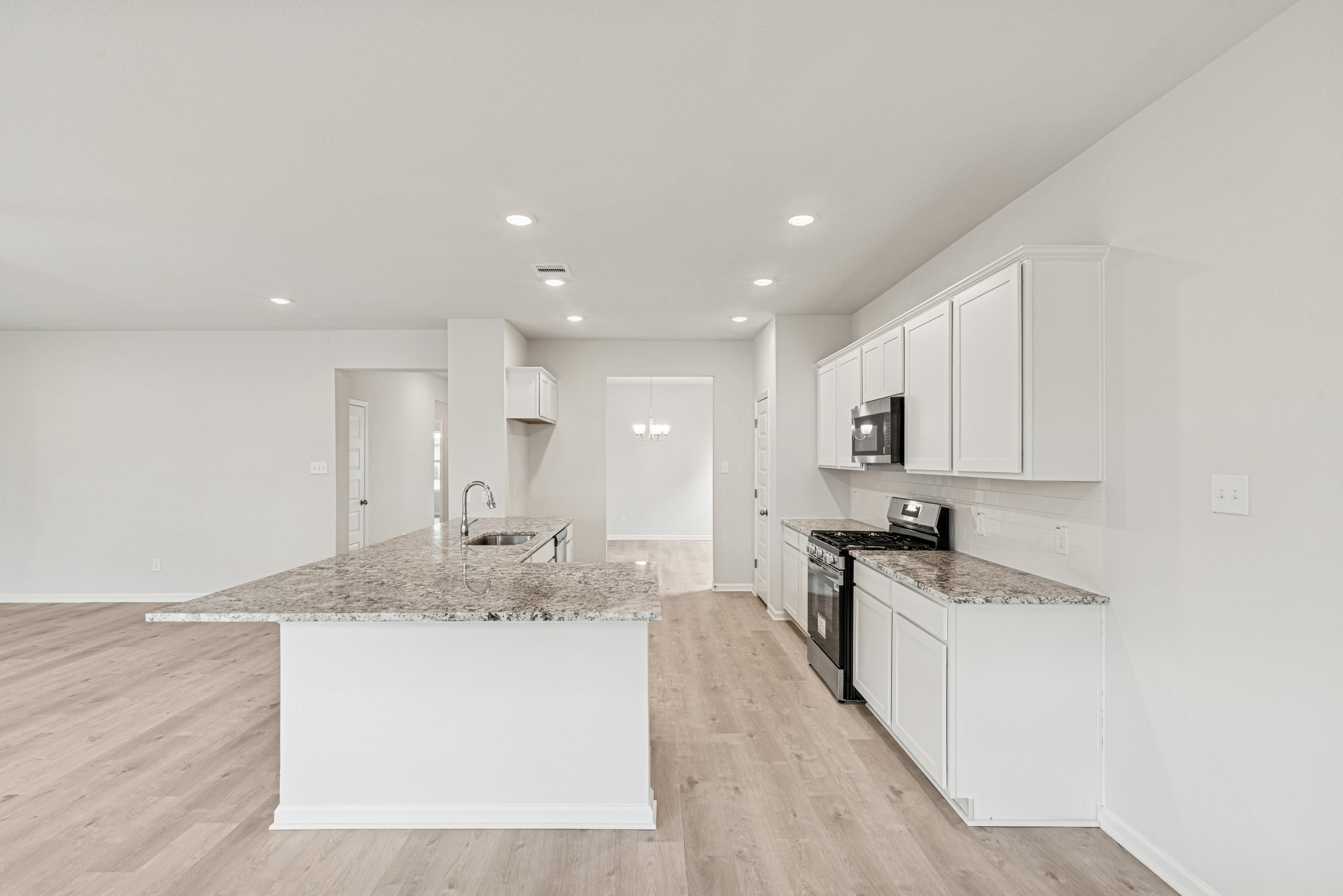 1903 Temple Grove Drive Rosharon, TX 77583 - Photo 12 of 37 The Avery- Kitchen open to dining room