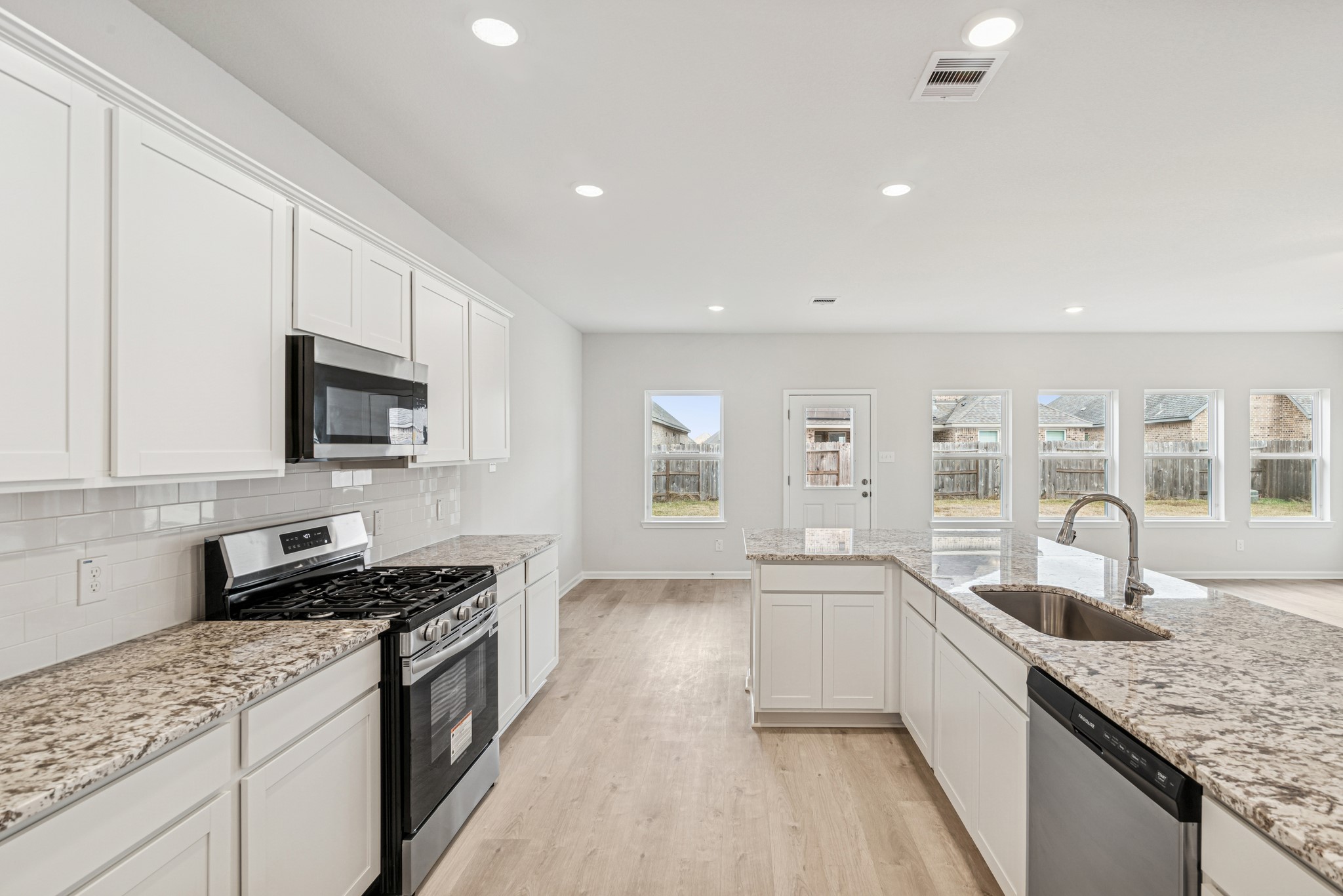 1903 Temple Grove Drive Rosharon, TX 77583 - Photo 6 of 37 The Avery- Kitchen into Breakfast Area