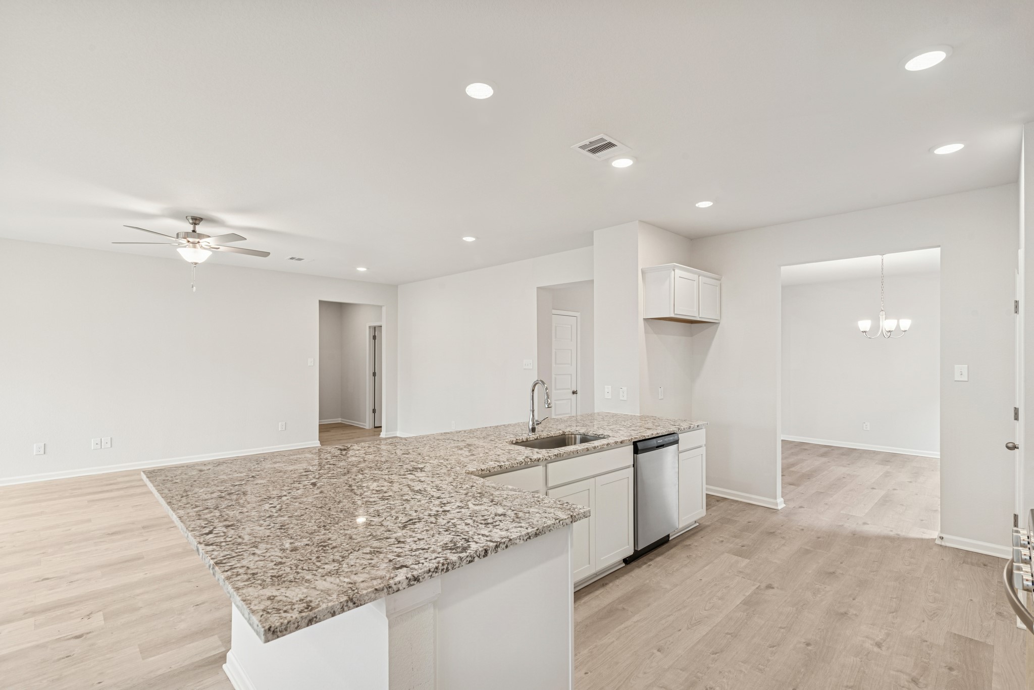 1903 Temple Grove Drive Rosharon, TX 77583 - Photo 7 of 37 The Avery- Kitchen open to Family Room