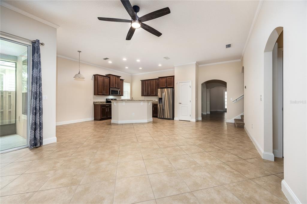 8216 Northwest 54th Street Gainesville, FL 32653 - Photo 25 of 58 a view of a kitchen with a sink and a refrigerator