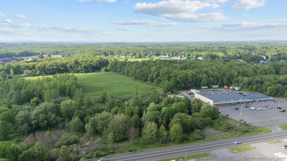 143 N Road East Windsor, CT 06088 - Photo 7 of 9 a view of a city with lush green forest