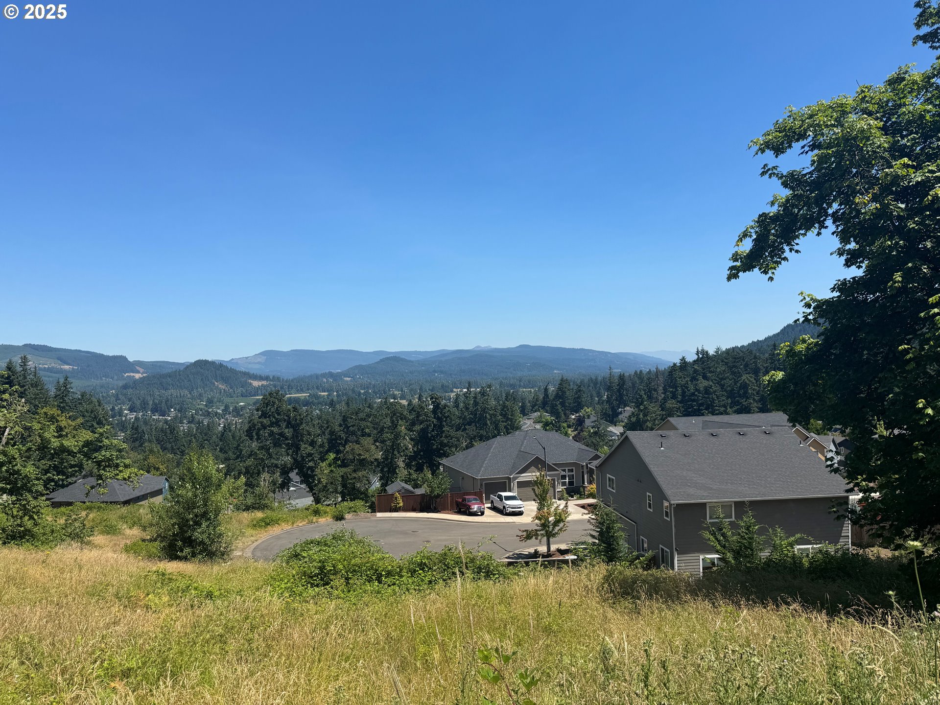 South 67th Springfield, OR 97478 - Photo 11 of 13 a view of a town with mountains in the background