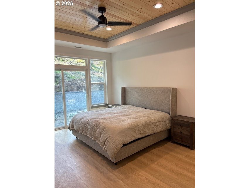 South 67th Springfield, OR 97478 - Photo 4 of 13 a bedroom with a large bed and a large window