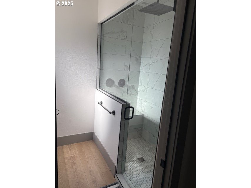 South 67th Springfield, OR 97478 - Photo 6 of 13 a bathroom with a glass door shower and a sink