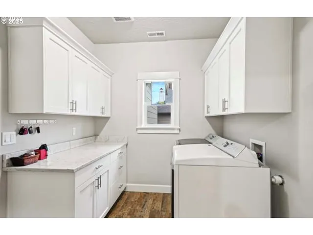 a utility room with closet dryer and washer