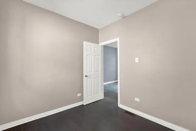 an empty room with closet area