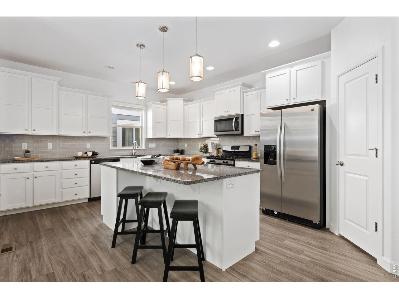 6511 19th Street Greeley, CO 80634 - Photo 7 of 26 Large Kitchen with Center Island is a Chef's Dream