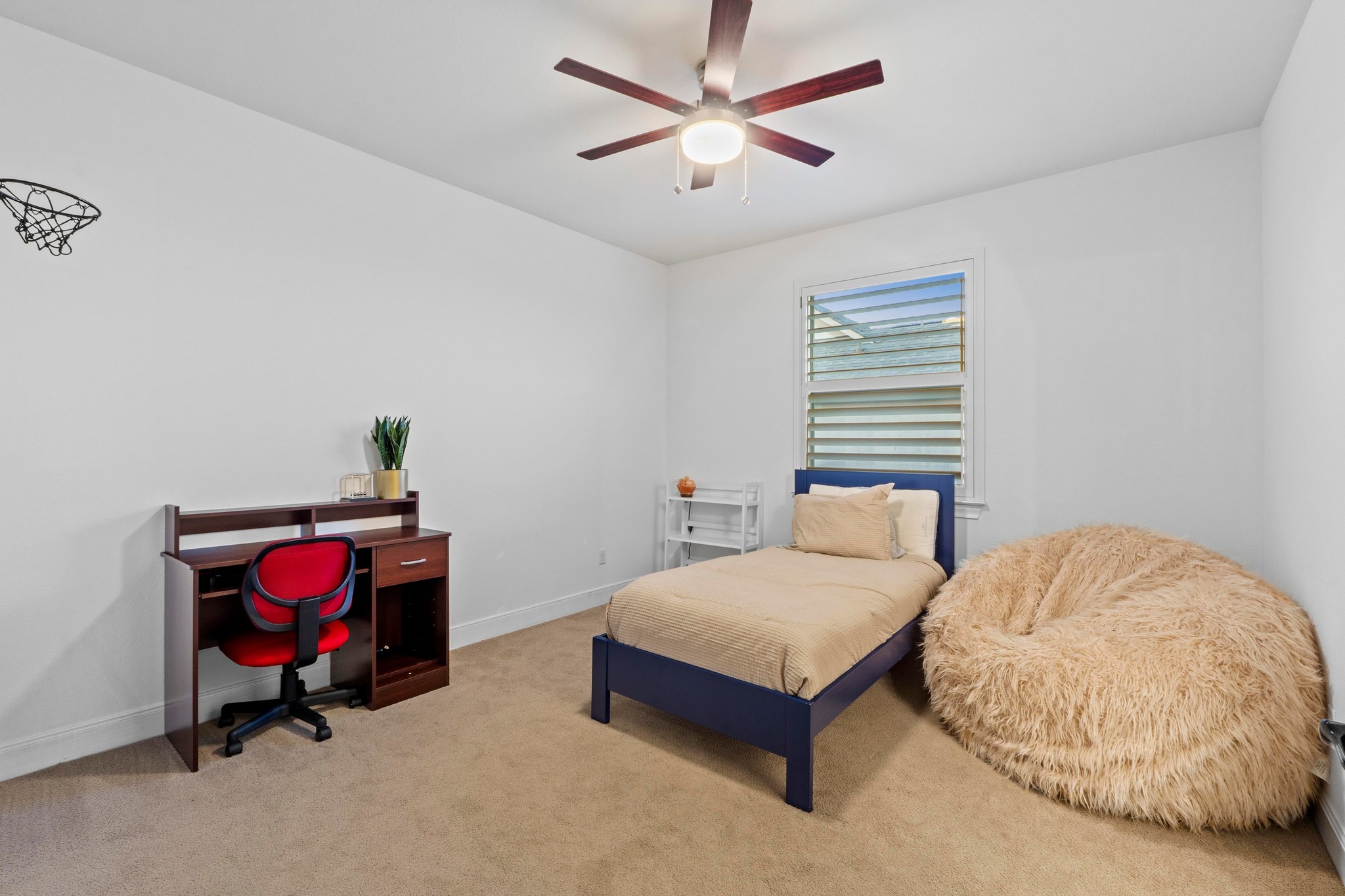 2520 Ionian Cove Austin, TX 78730 - Photo 28 of 40 a bedroom with a bed and a chandelier