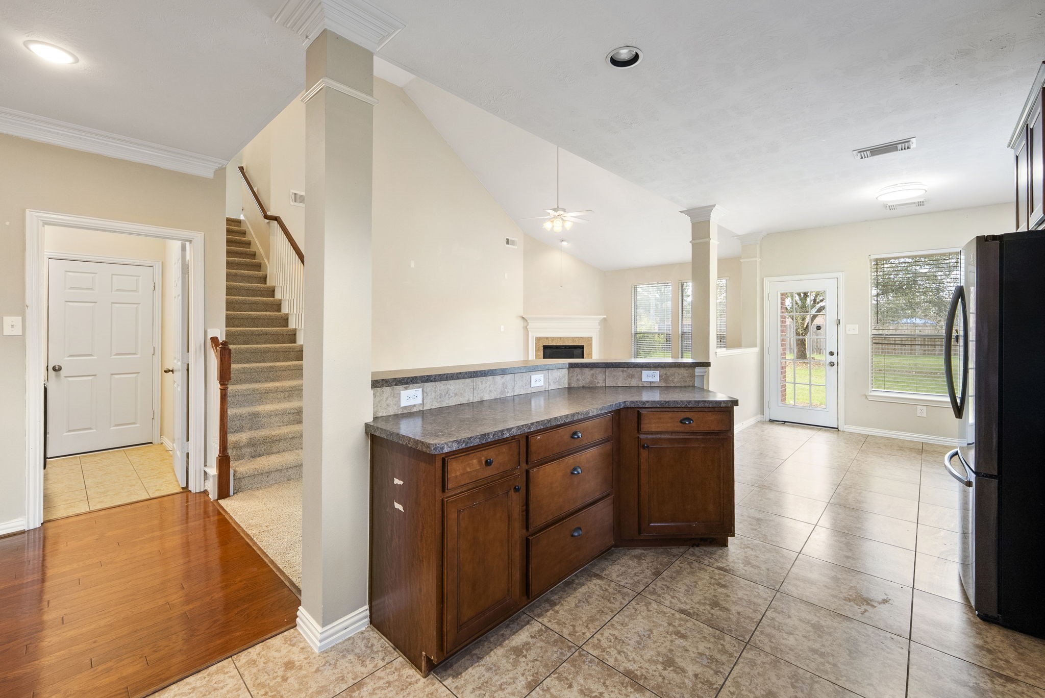 9526 Tartan Manor Street Spring, TX 77379 - Photo 12 of 42 a large kitchen with kitchen island a sink stainless steel appliances and cabinets