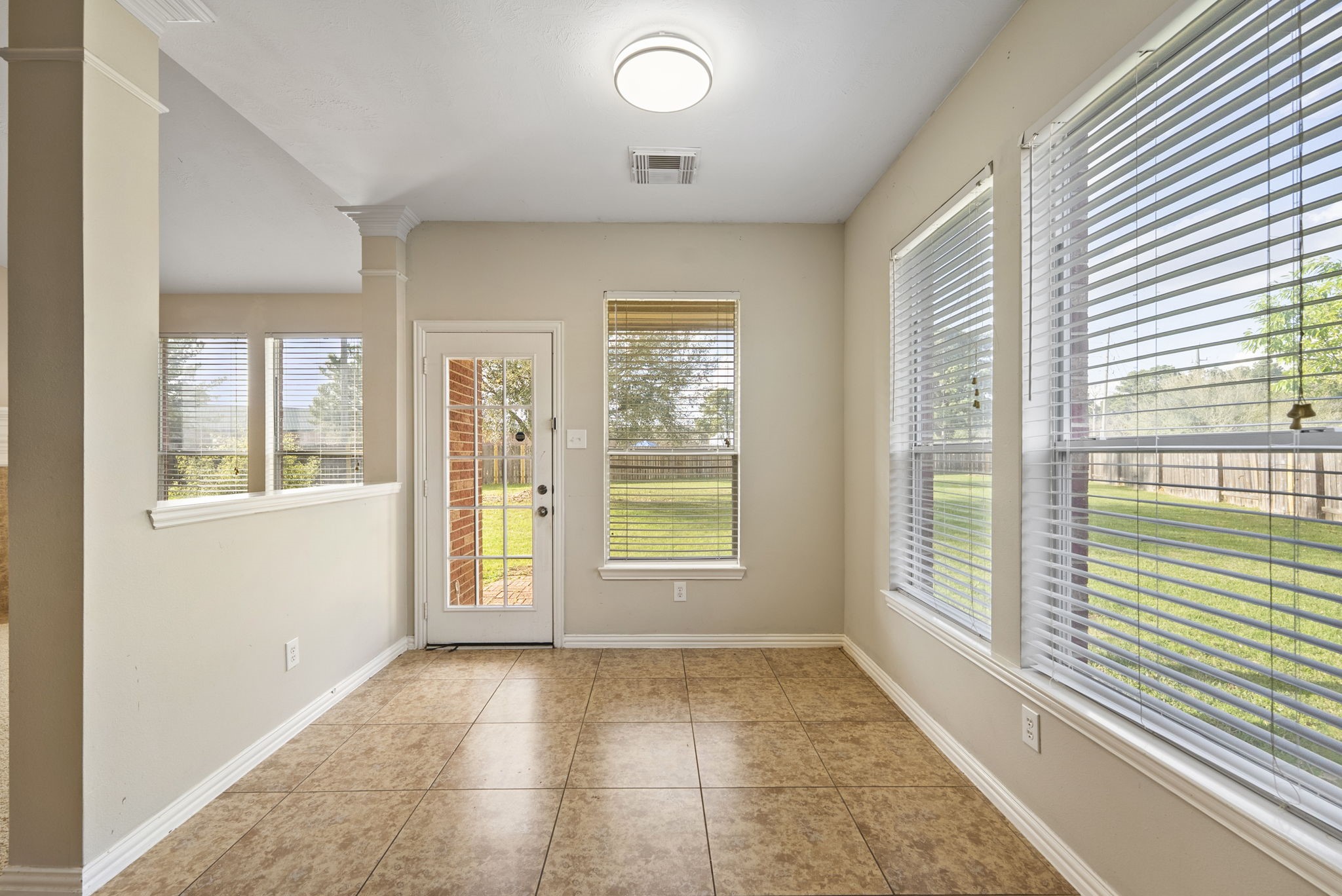 9526 Tartan Manor Street Spring, TX 77379 - Photo 18 of 42 a view of an empty room with a window