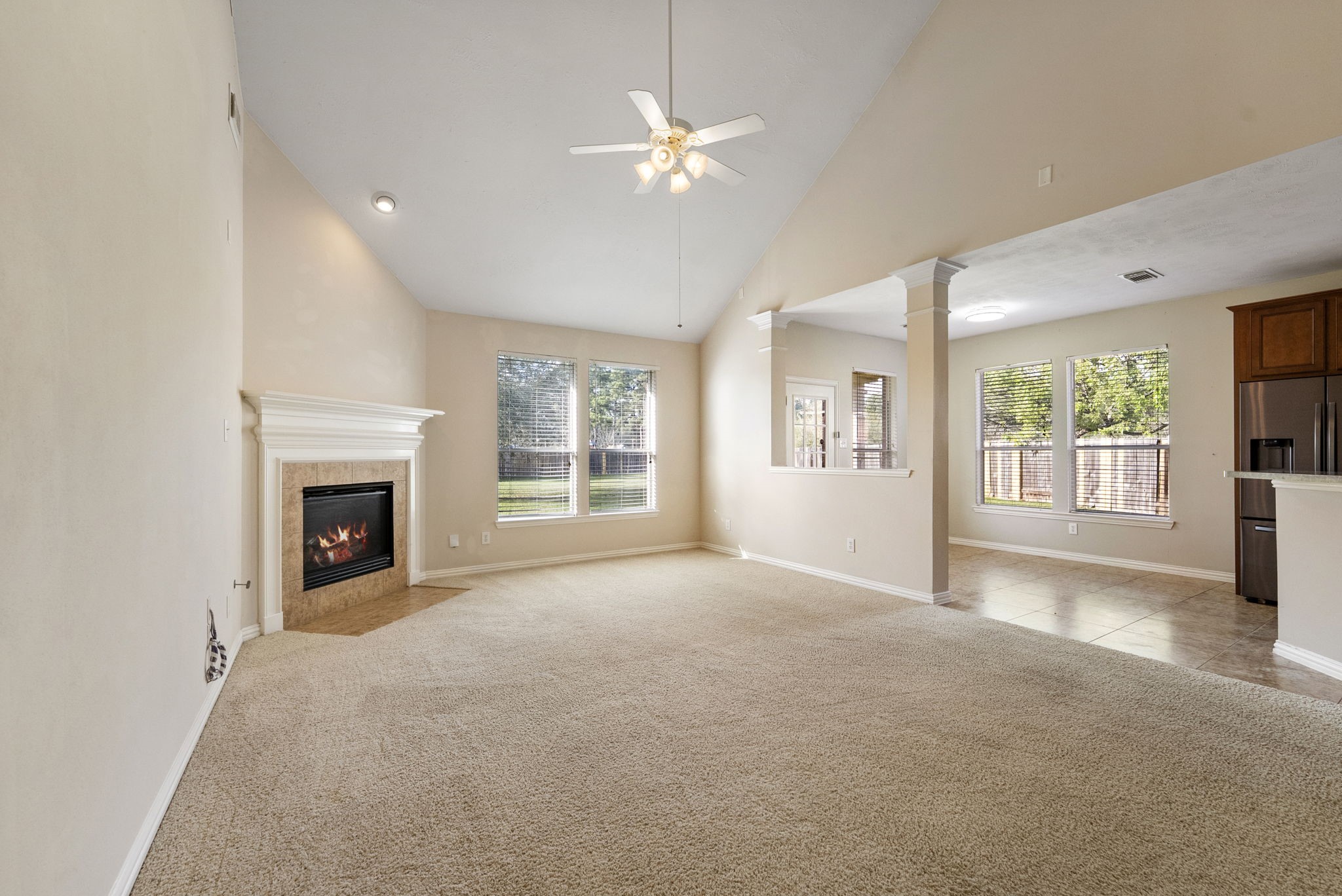 9526 Tartan Manor Street Spring, TX 77379 - Photo 19 of 42 a view of a livingroom with a fireplace and a window