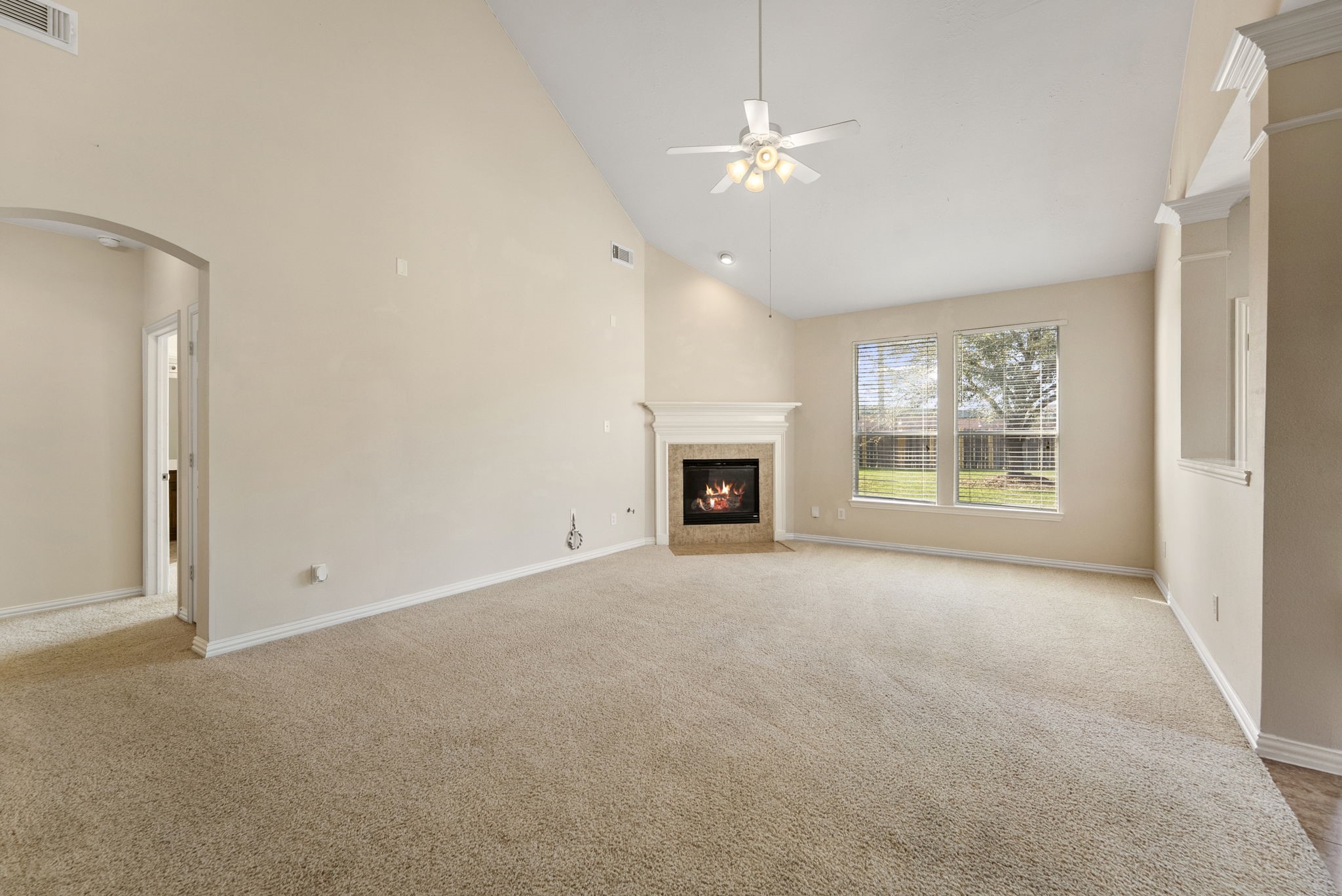 9526 Tartan Manor Street Spring, TX 77379 - Photo 21 of 42 a view of empty room with fireplace and fan