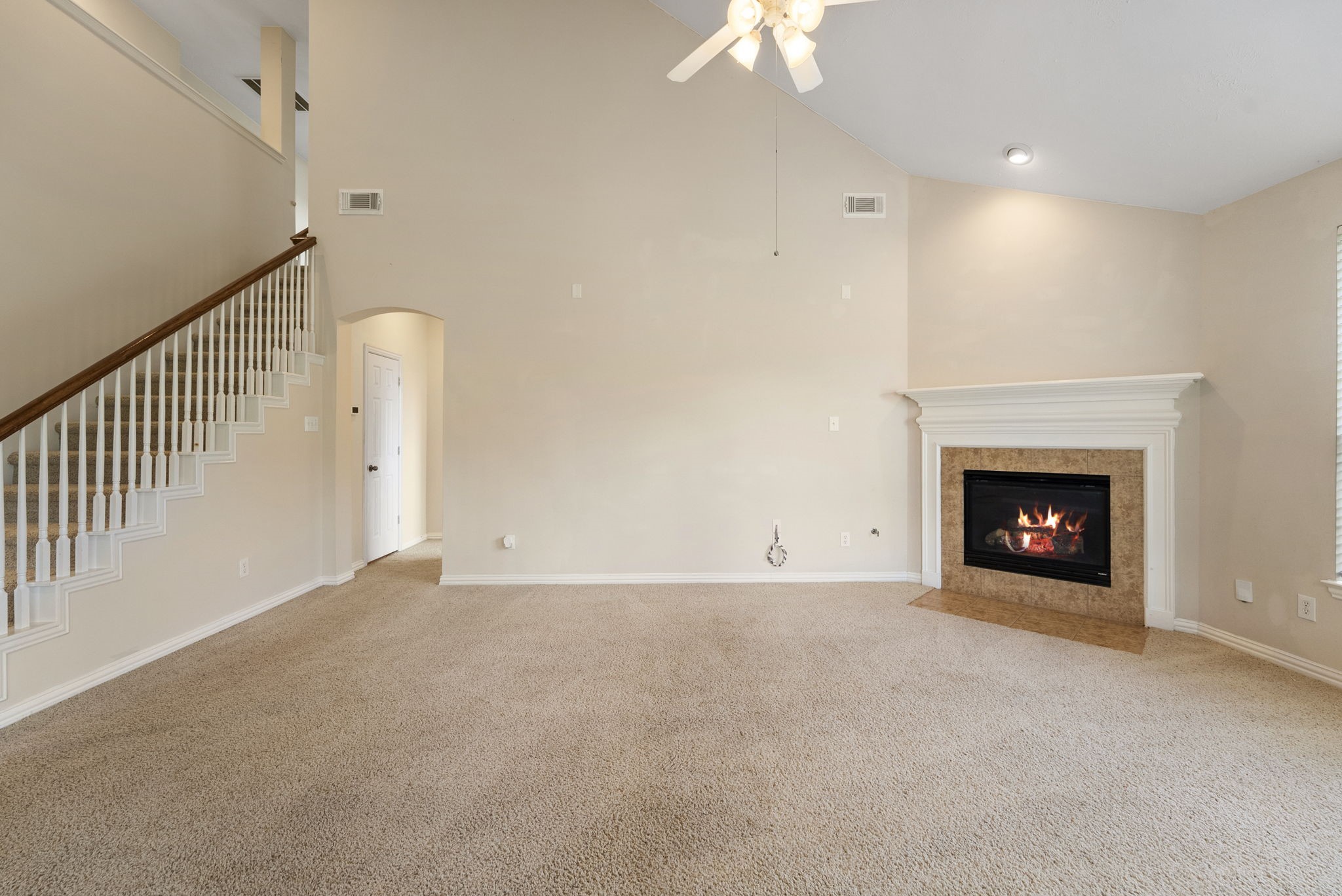 9526 Tartan Manor Street Spring, TX 77379 - Photo 22 of 42 a view of an empty room with a fireplace