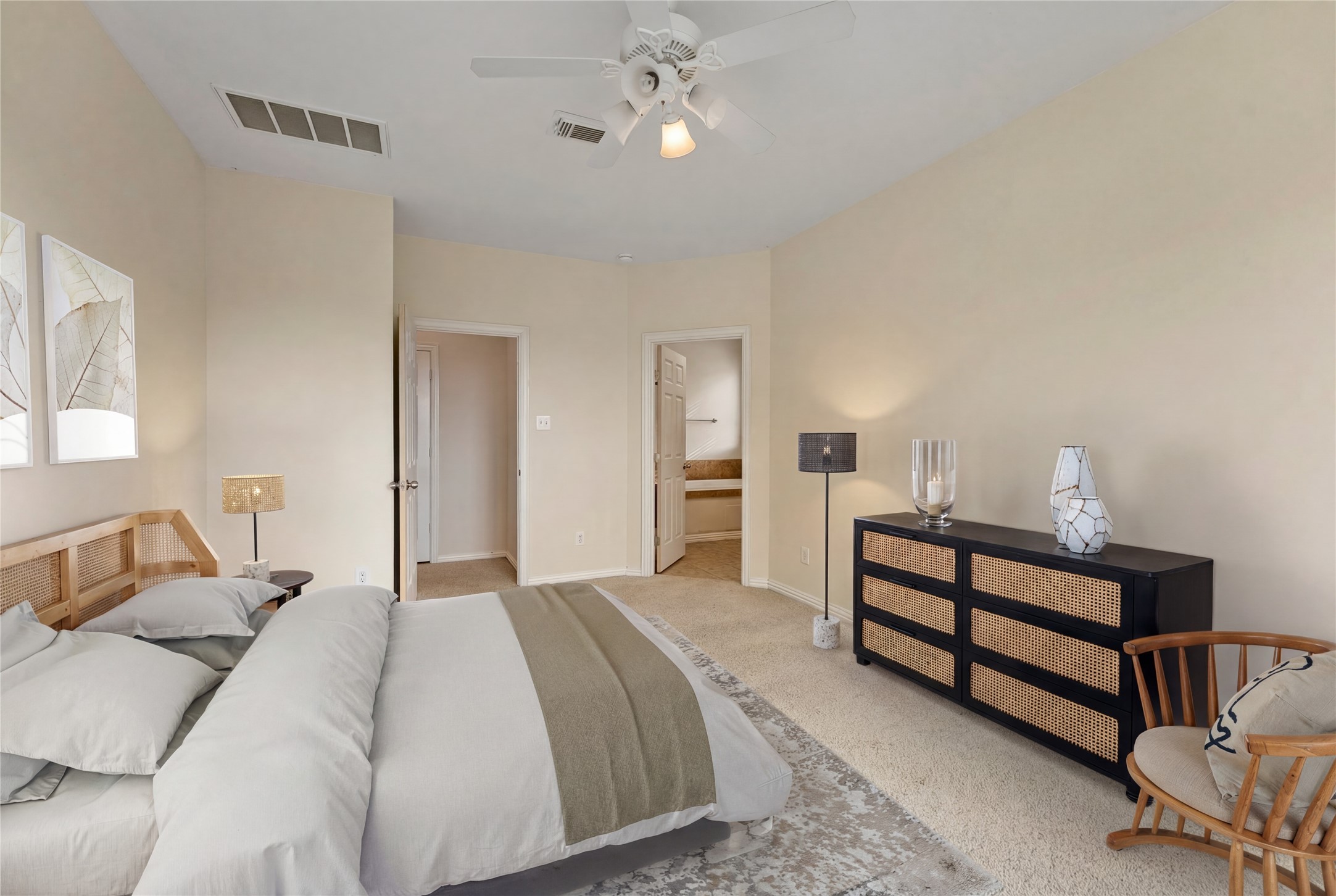 9526 Tartan Manor Street Spring, TX 77379 - Photo 25 of 42 a bedroom with a bed and a chandelier