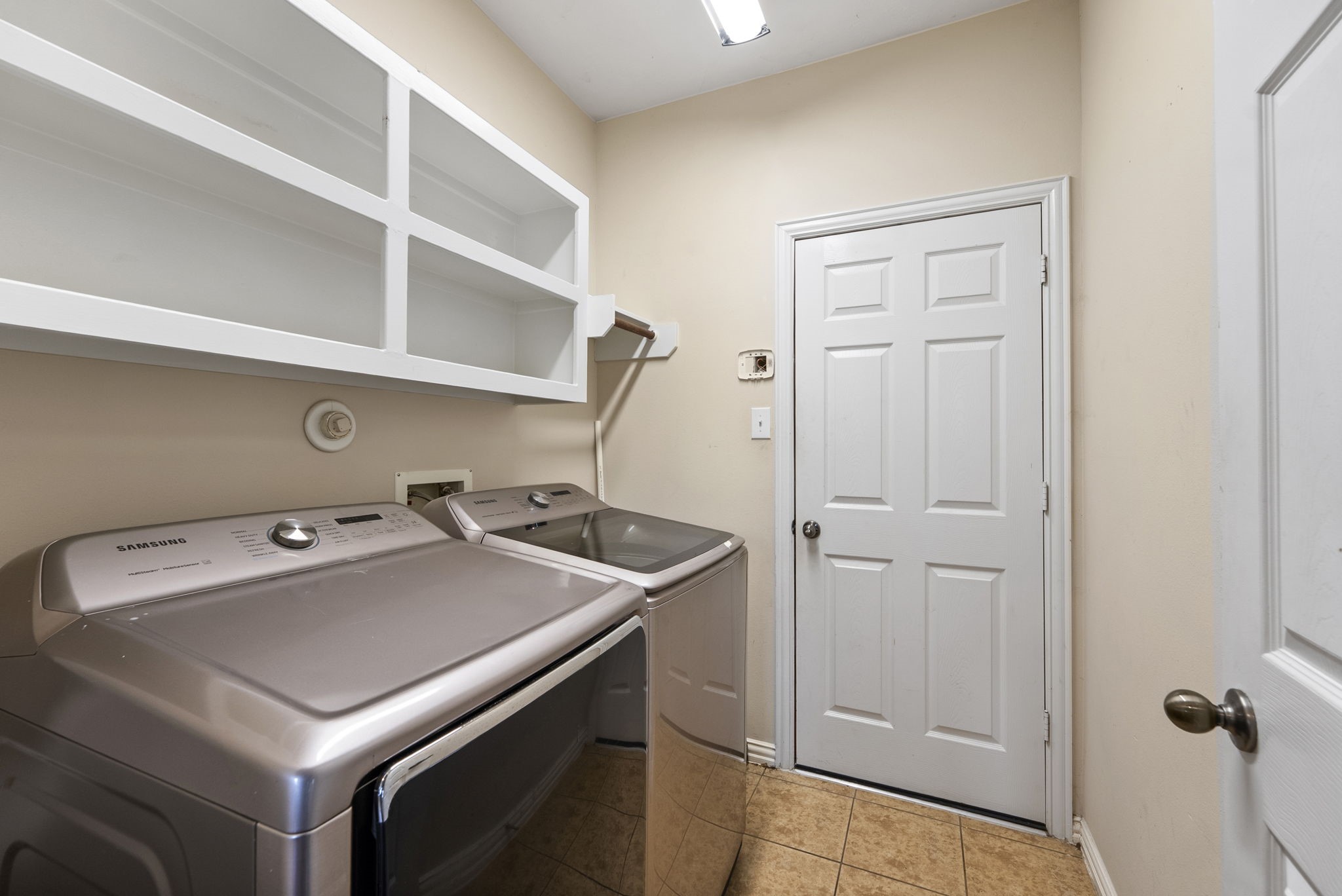 9526 Tartan Manor Street Spring, TX 77379 - Photo 31 of 42 a utility room with dryer and washer