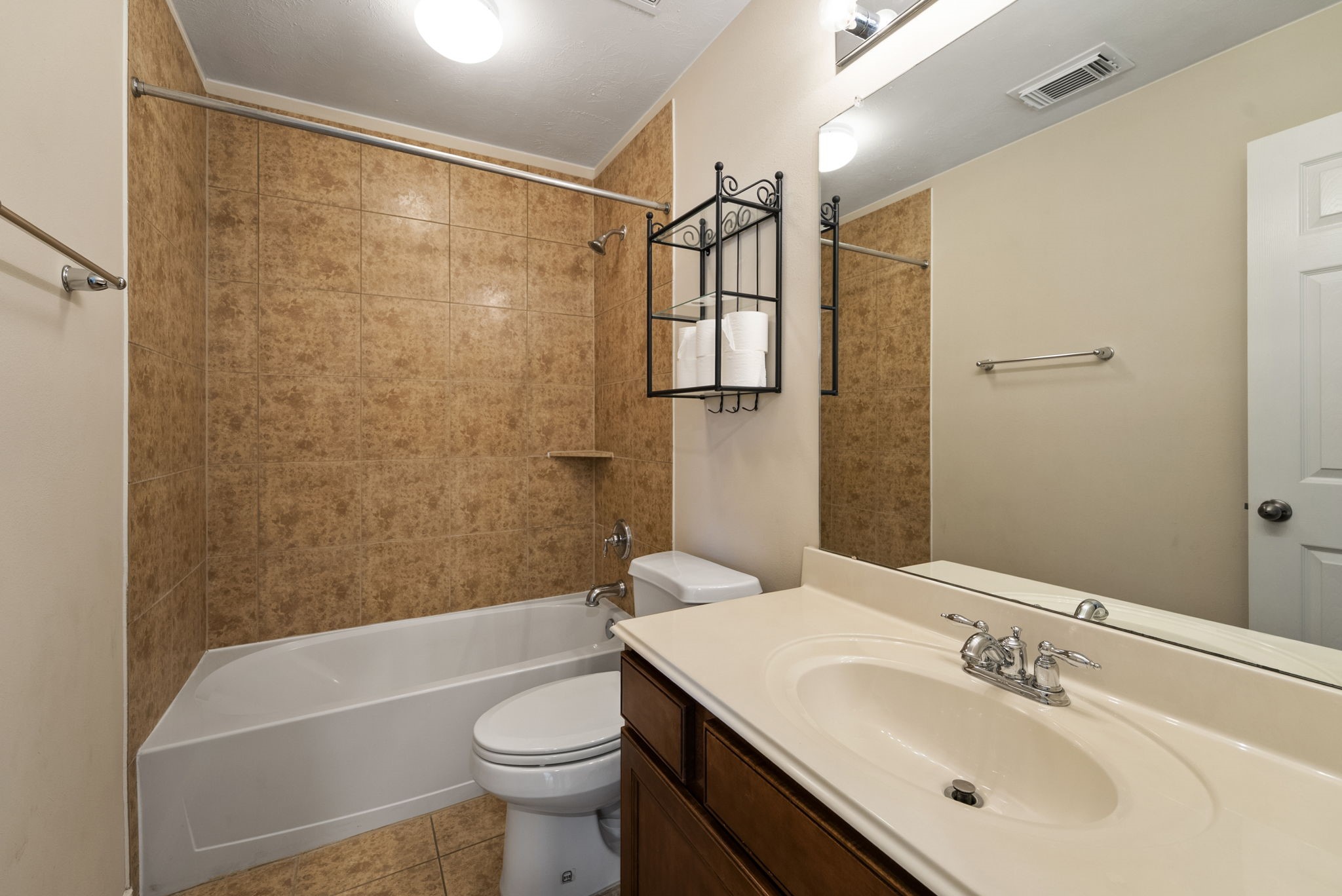 9526 Tartan Manor Street Spring, TX 77379 - Photo 36 of 42 a bathroom with a sink a toilet and shower