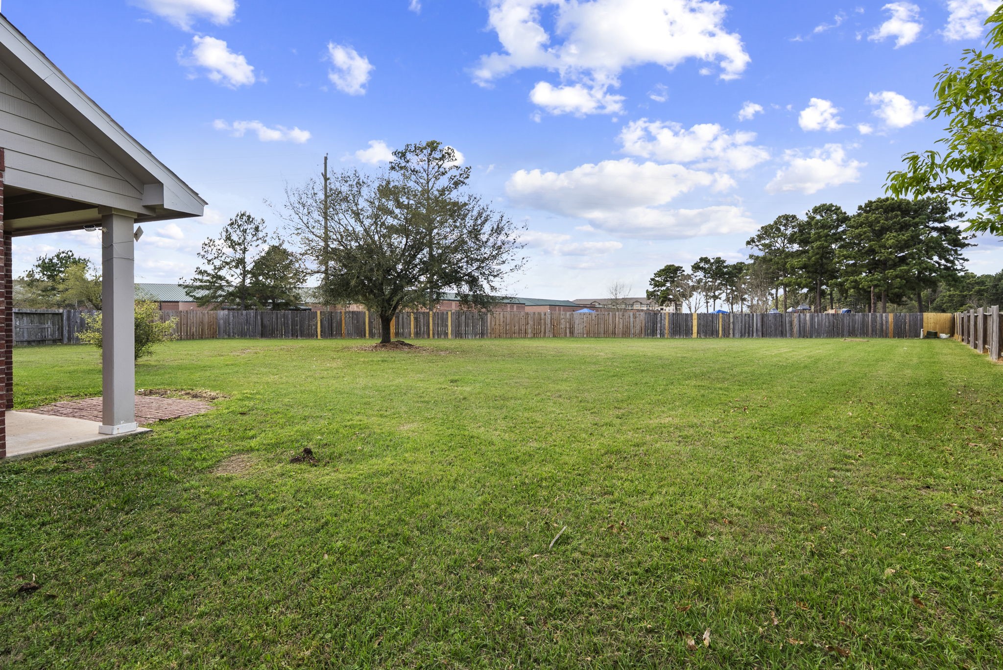 9526 Tartan Manor Street Spring, TX 77379 - Photo 41 of 42 a view of a yard with a house in the background