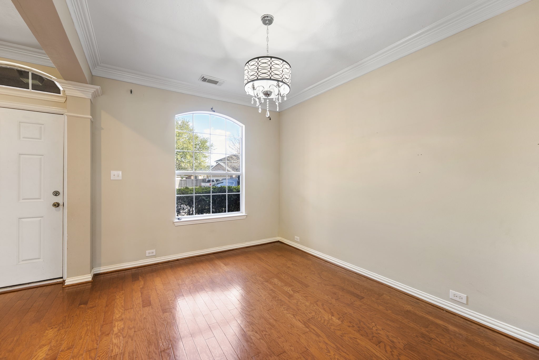 9526 Tartan Manor Street Spring, TX 77379 - Photo 7 of 42 a view of empty room with wooden floor and fan