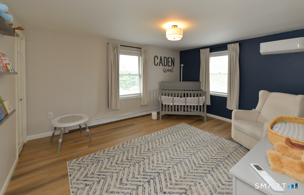 109 Harrison Lane Bethlehem, CT 06751 - Photo 21 of 28 a bedroom with furniture and a window