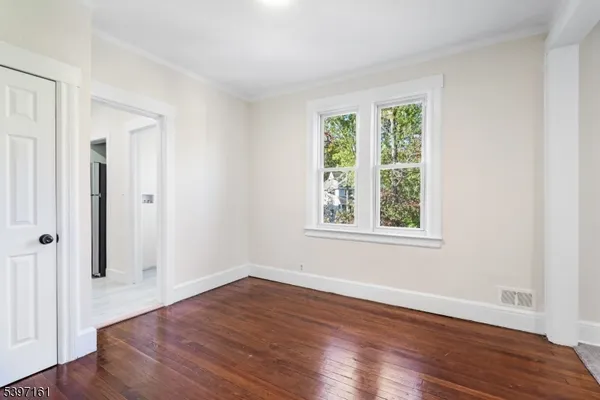 a kitchen with cabinets appliances and a window