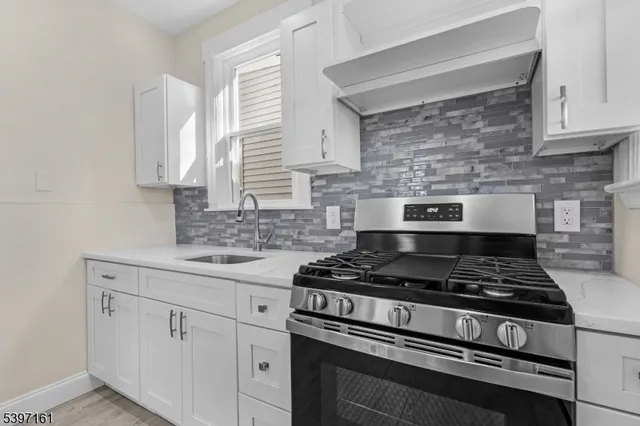 a view of hallway with wooden floor