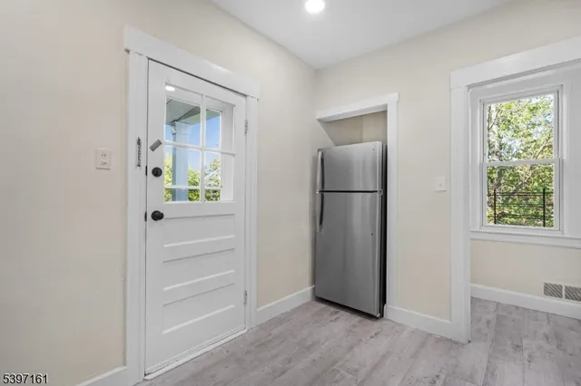 a view of a balcony with wooden floor