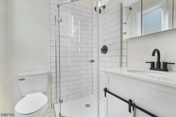 a bathroom with a toilet sink and shower