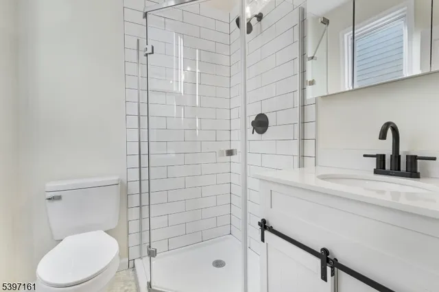 a bathroom with a toilet sink and shower