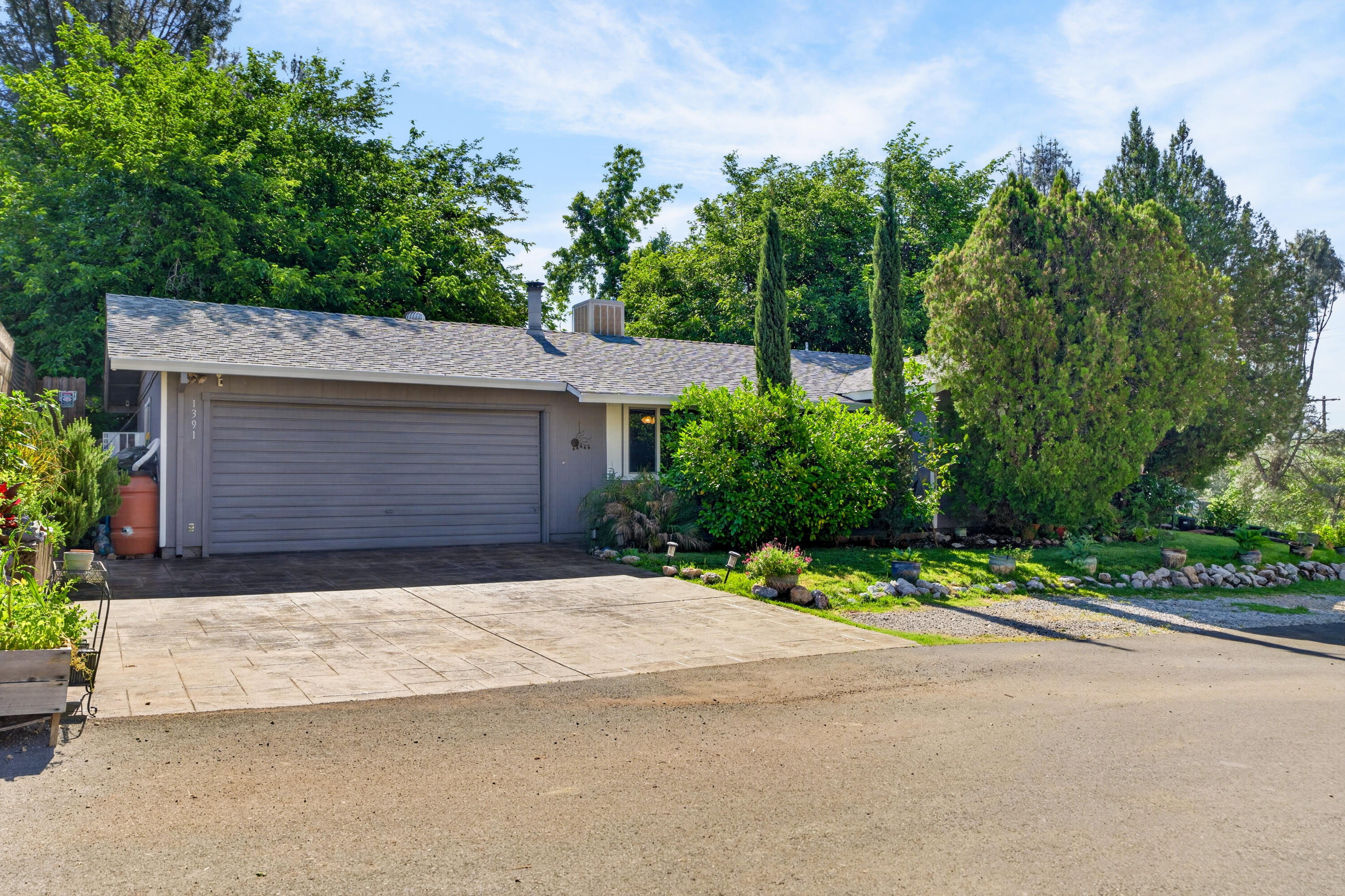 1391 Rouge Road Shasta Lake, CA 96019 - Photo 1 of 30 a front view of a house with a yard and trees